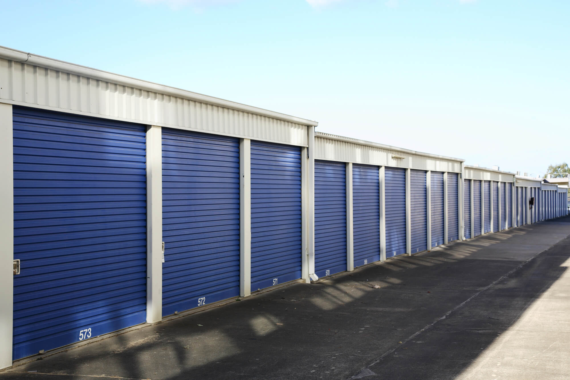 Outdoor storage with blue shutters