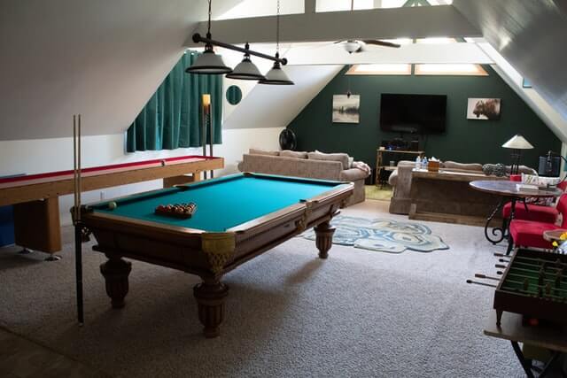 Blue pool table in a room