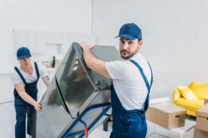 movers moving a fridge
